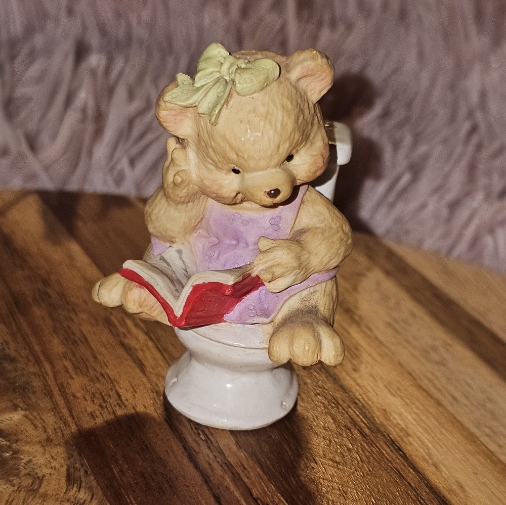 Girl bear on toliet